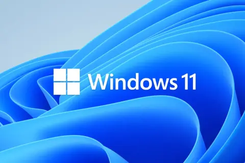 Logo Windows 11 na niebieskim tle. Dowiedz się, jak zainstalować Windows 11, aby cieszyć się nowym systemem.
